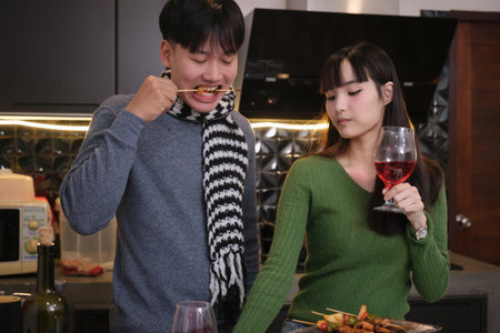 Young Asian couple living at home in winter seasonの写真素材