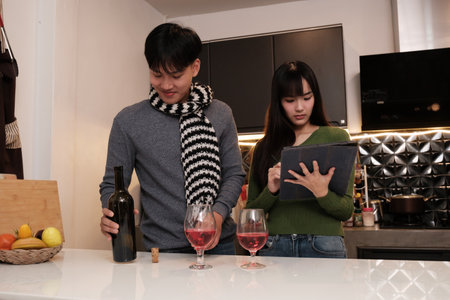 Young Asian couple living at home in winter seasonの写真素材