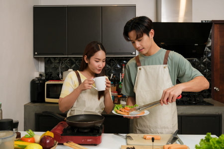 Asian Young couple cooking in the kitchen at home