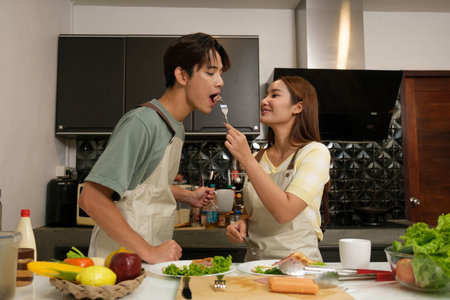 Asian Young couple cooking in the kitchen at home