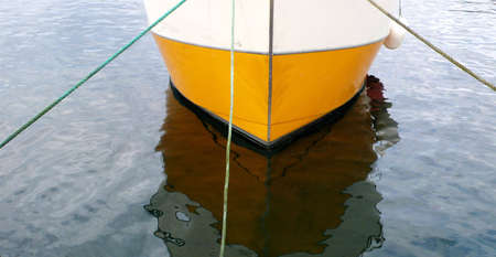 The bow of a Boat tied to the pierの写真素材
