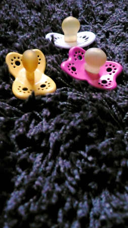 Three pacifiersの写真素材