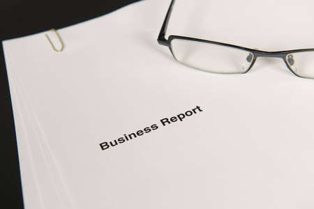 Business report and glasses