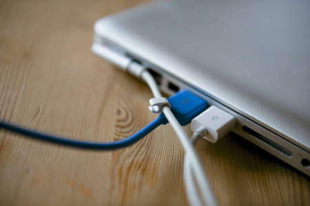 Computer with attached cablesの写真素材