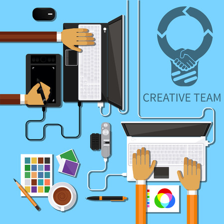 Team of designers working together on a computer. Creative team. flat design styleのイラスト素材