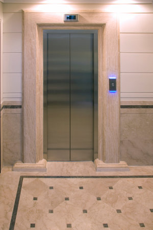 Elevator doors and stone walls
