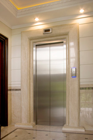 Interior of a hotel room with elevator door