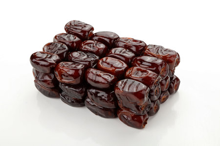 dates fruit over a white background.