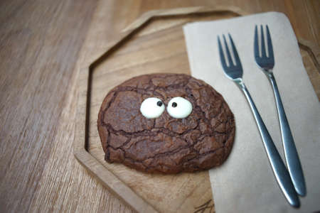 Chocolate cookie in a wooden plateの写真素材