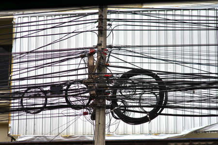 Power lines in the middle of the roadの写真素材