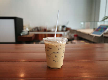 Iced Latte in a cup at coffee shopの写真素材