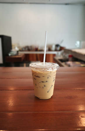 Iced Latte in a cup at coffee shopの写真素材