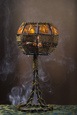 Candle holder in smoke.