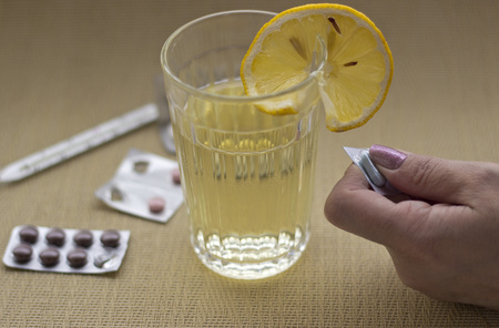 Woman taking medication.の写真素材