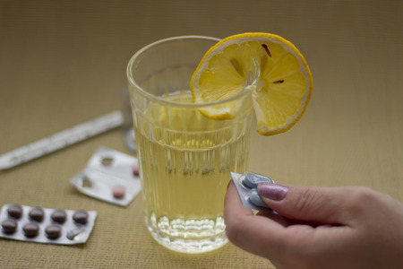 Woman taking medication.の写真素材