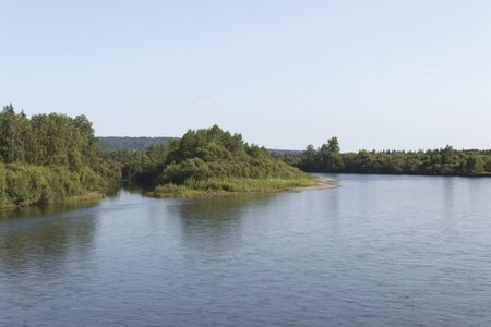 beautiful banks of a quiet river, summer day.の写真素材