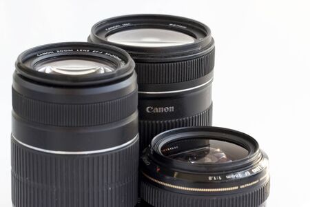 Russia, Krasnoyarsk, July 2019: Set of Canon EF lenses on a white backgroundのeditorial素材