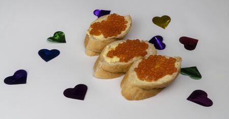 sandwich with red caviar for lovers. appetizer on a white background.