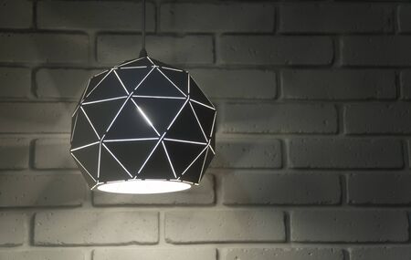 lamp on the background of a white brick wall. loft style.