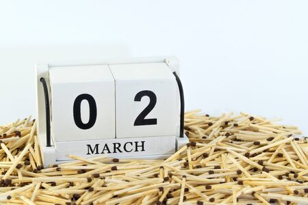 March 2nd. Day 2 of month, wooden calendar on white background. Design for International Matchstick.