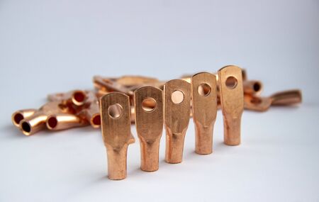 Copper electric terminals. connection tips for cables and wires. electrician accessories and spare parts. reliable contact. energy industry and electrical safety concept. copy space.の写真素材