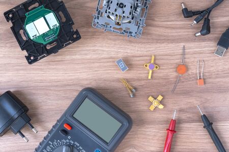 Multimeter and power supply cables. conducting tests and electrical measurements. electronics...