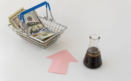 oil and money. concept of petroleum products price growth. futures contract for the purchase or sale of oil. crisis, changes in price quotations for black gold.の写真素材