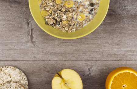 muesli with milk and fruit. top view, copy space. Fresh granola. concept of proper nutrition and a healthy lifestyle. Useful mixtures remarkably remove harmful substances, slags.の写真素材