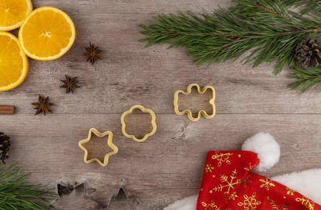 preparing festive treats for Christmas and new year holidays. cookie molds and flour. orange and star anise.の写真素材