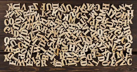 background is made of wooden jumbled letters. english alphabet. vintage letterpress types. English Language Day.の写真素材