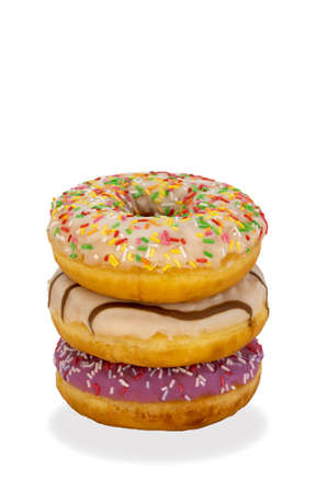 delicious doughnuts on a white background. rounded or ring-shaped, deep-fried bakery product. donut topped with icing sugar and a bright sprinkle.の写真素材