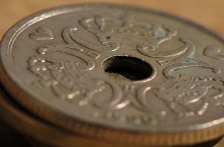 Looking closer at a coin. Danish coin, kroner.
