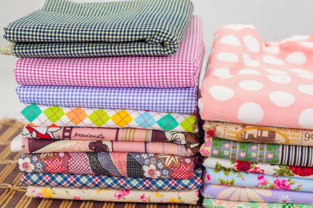 heap of cloth fabrics on bamboo mat pattern