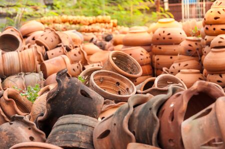 A background with a view of different clay objects at a pottery shop