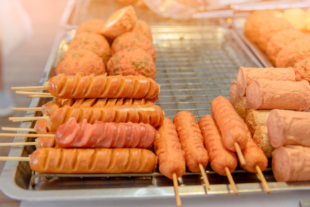 Grilled sausage on the flaming grill prepared  for sale at local marketの写真素材
