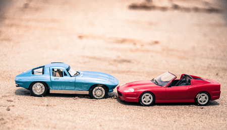 Toy car on beach, Accident concept