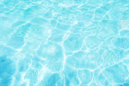 Abstract water wave, sun reflections in pool waterの写真素材
