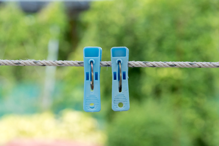 Cloth clamp, plastic cloth clamp, hanging on rope.の写真素材