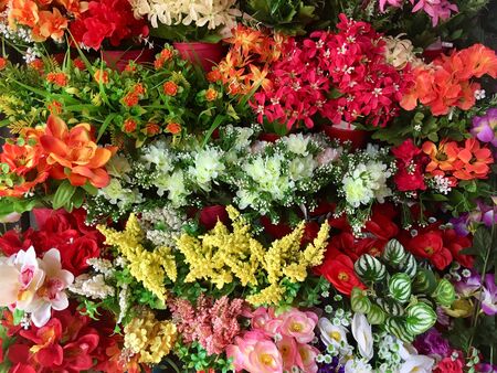 Multi colored background from plastic flowersの素材