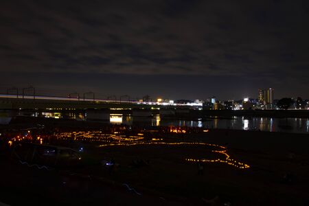 A burning romantic candles at the park wide shot at duskの写真素材