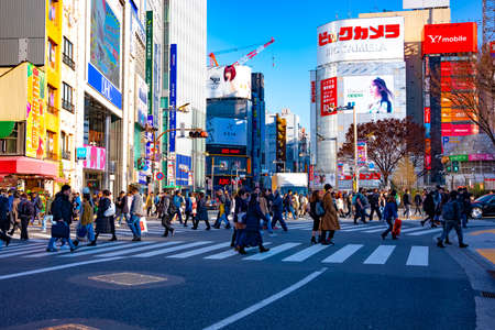 A crossing at the urban city wide shot. Shinjuku district Tokyo Japan - 01.20.2020 : It is a center...