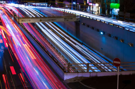 A night traffic jam at the city street in Tokyo long shotの写真素材