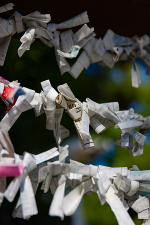 A fortune telling slip at Tomioka Shrine closeupのeditorial素材
