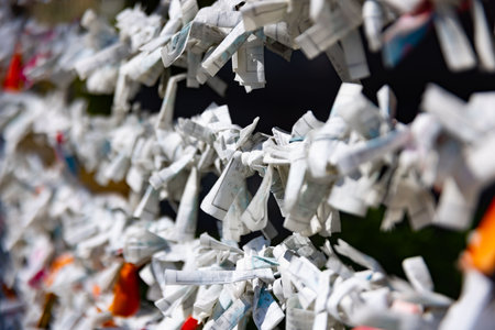 A fortune telling slip at Tomioka Shrine closeup