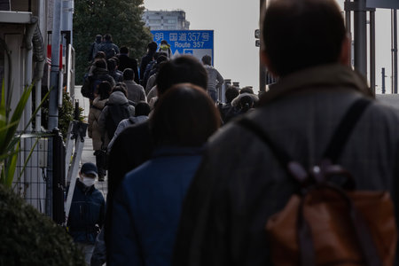 A crowd of walking people on the city streetの写真素材