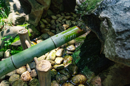 A Japanese Bamboo Water Fountain Shishi-Odoshi in Zen Gardenの写真素材
