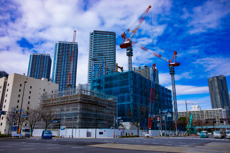 Cranes at the under construction in Tokyo wide shot