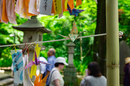A paper crane swaying in the wind at the traditional street close upの写真素材