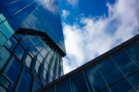 A cloud reflecting a building in the business townの写真素材
