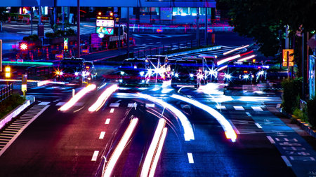 A night timelapse of the urban city street in Aoyama long shot panningの写真素材